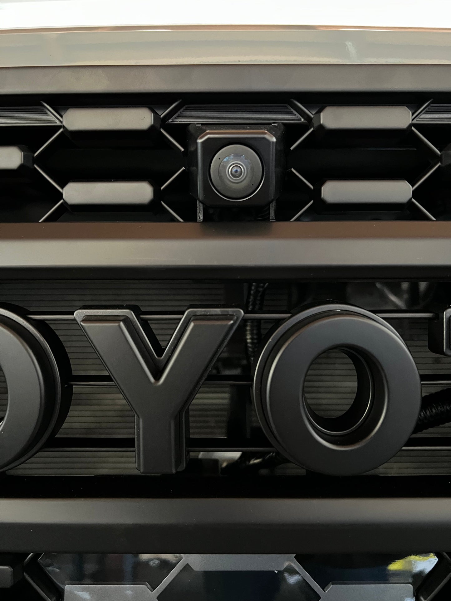 Front OEM Camera Mounting Bracket for Aftermarket TRD Pro Grille 2020 - 2023 Toyota Tacoma.