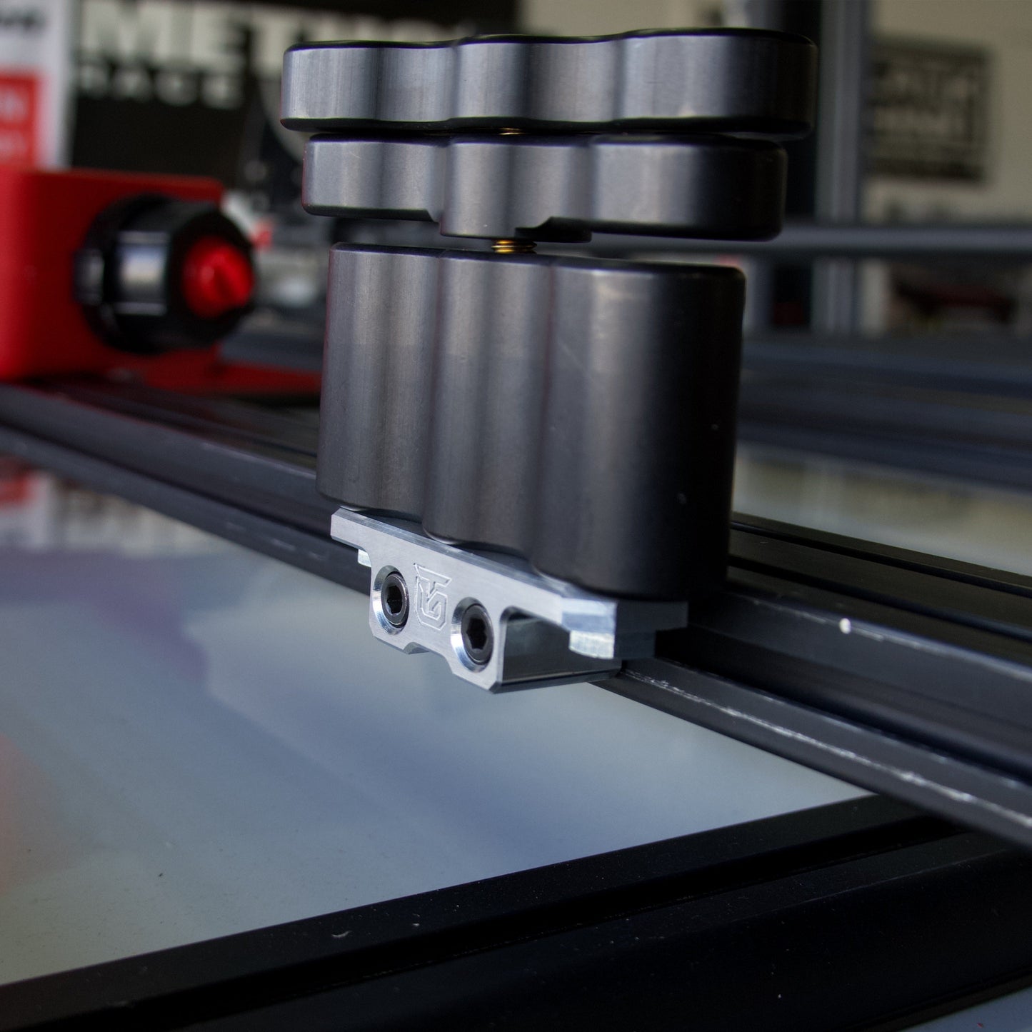 Billet aluminum Rotopax mount adapter for extrusion roof rack cross bars.