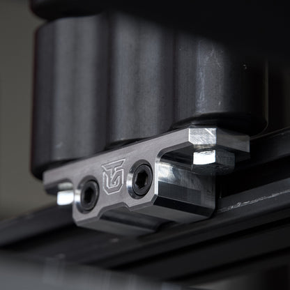 Billet aluminum Rotopax mount adapter for extrusion roof rack cross bars.
